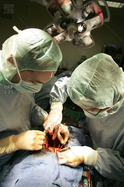 View from above of surgeons performing a heart transplant