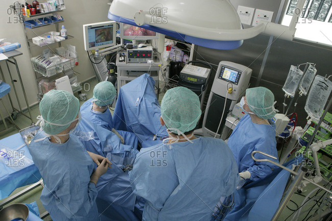 Surgeons performing Myomectomy procedure, removing uterine fibroids
