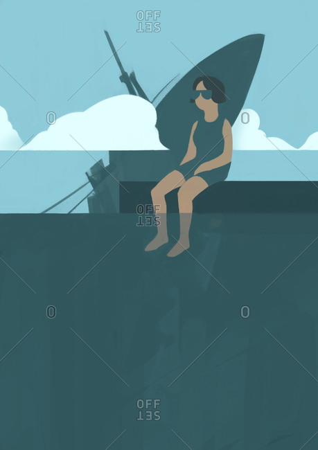 Woman dipping feet in the ocean while ship sinks behind her
