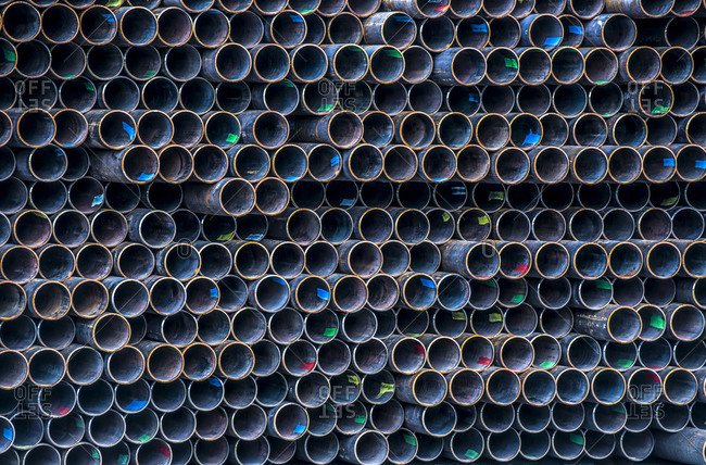 Close-up of stack of metal pipes