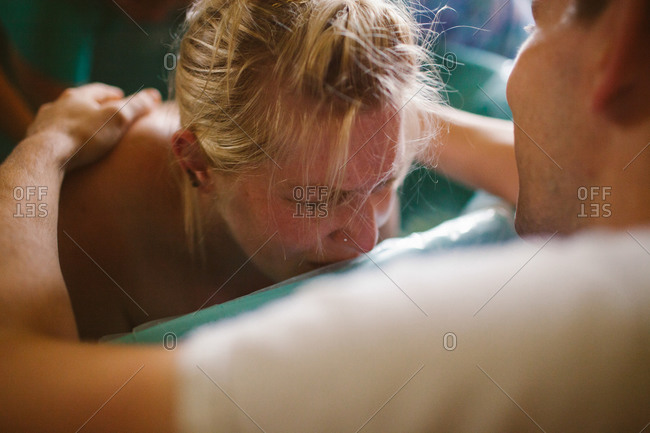 Woman crying from labor pains