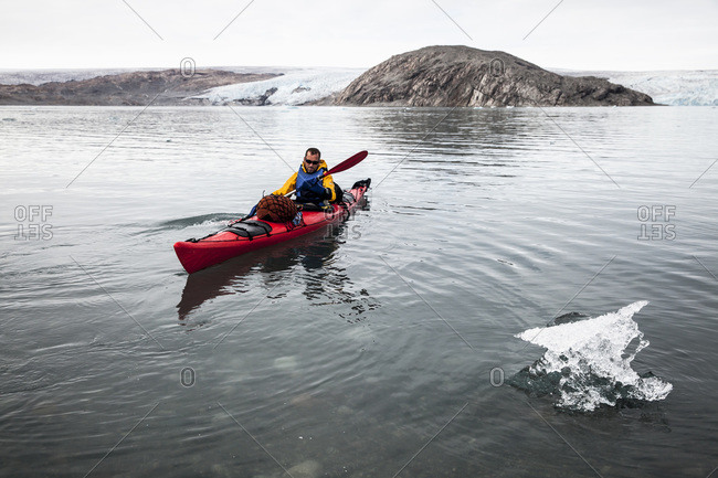 Mature man kayaking on sea