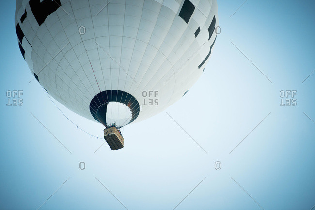 Low angle view of hot air balloon against clear blue sky