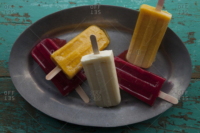 Top view of colorful Mexican paletas on tray