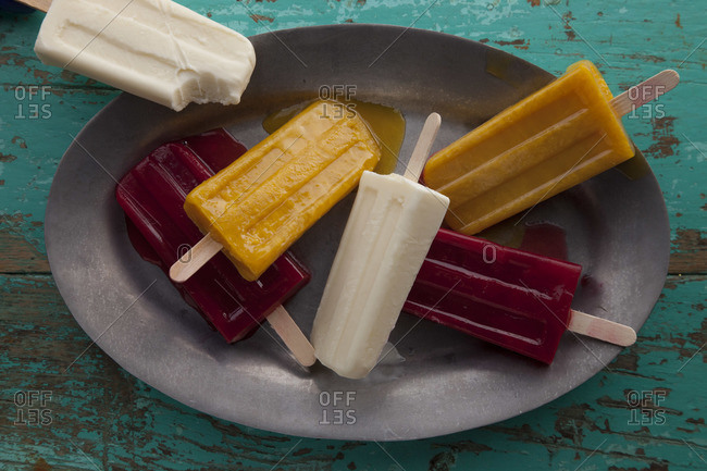 Top view of colorful Mexican paletas on tray