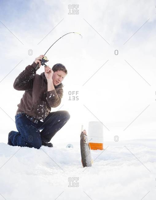 Man ice fishing