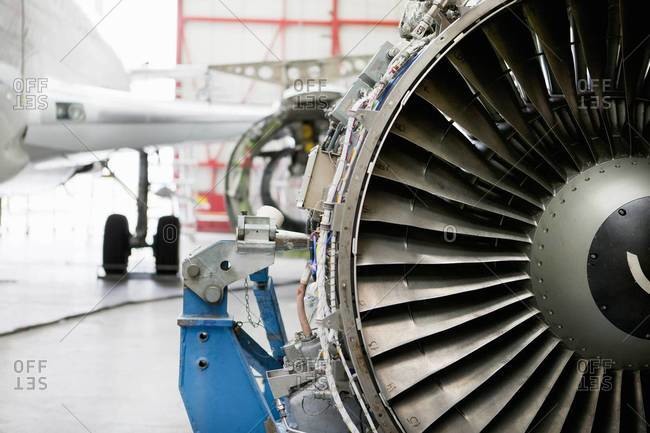 Close up of passenger jet engine in hangar