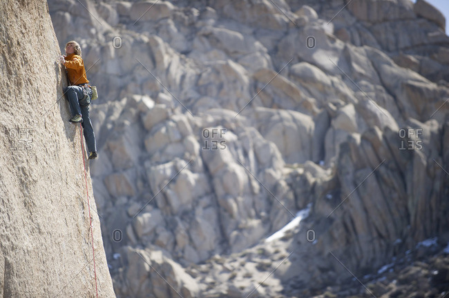 A man sport climbs in Bishop, California