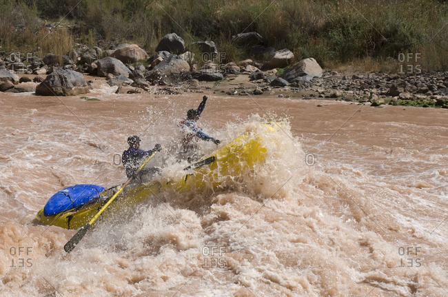 Rafters pushing through a big wave in Lava Falls rapid on the Colorado River