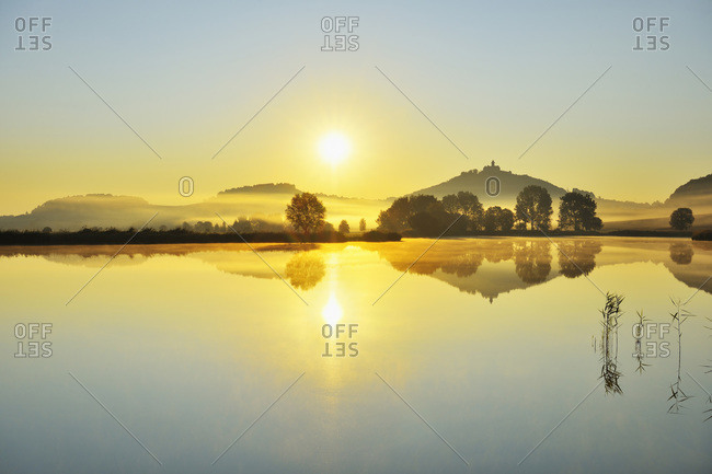Wachsenburg Castle with Morning Mist and Sun reflecting in Lake at Dawn, Drei Gleichen, Thuringia