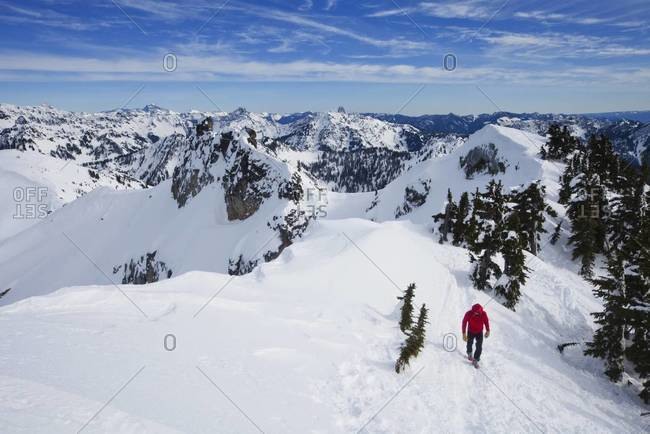 Climber on the summit of Snoqualmie Peak in the Cascades range of mountains in Washington state, USA