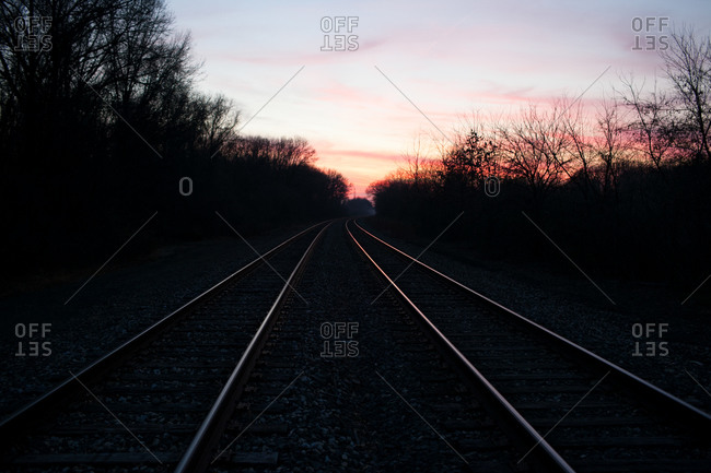 The sun sets on train tracks in rural Indiana