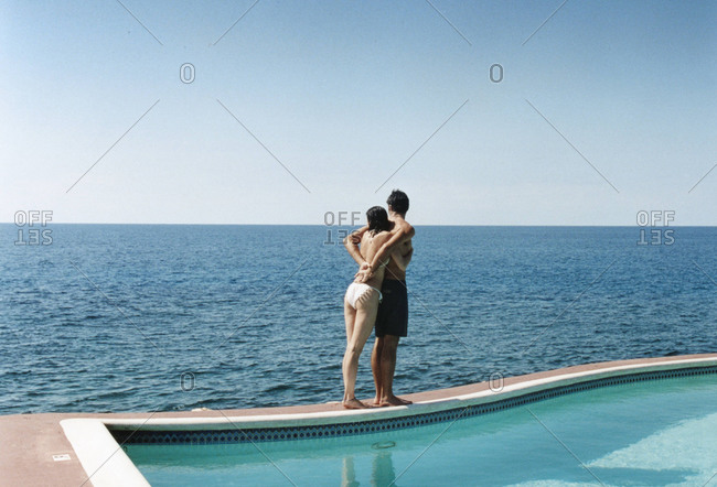 Couple By Pooling Looking at the Ocean