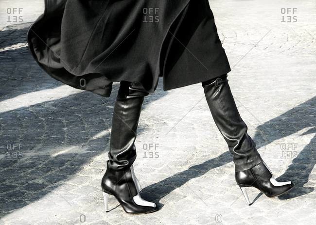 Woman Walking in Tall Black Boots