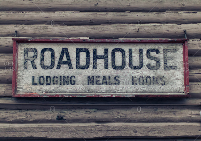 Close up of a weathered sign of a roadhouse