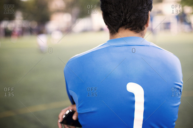 Rear view of soccer player on soccer field