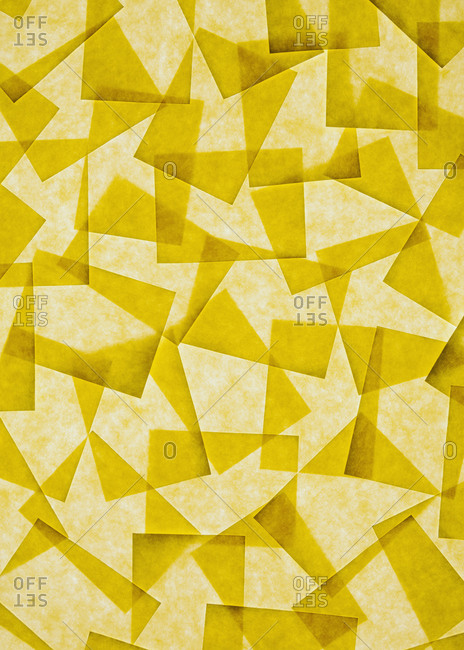 Post it notes arranged and overlapping, above a light source.