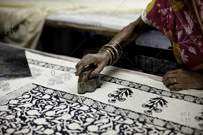 Indian woman hand block prints on textile