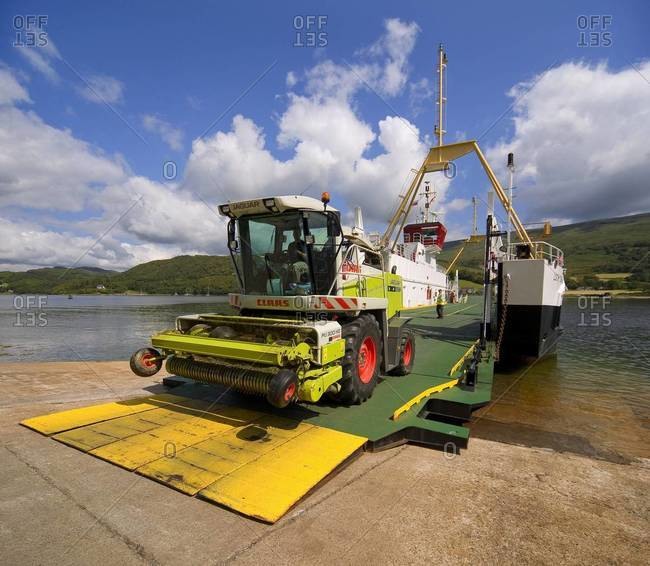 Agriculture machinery drives off the Colintrive ferry on the Isle of Bute