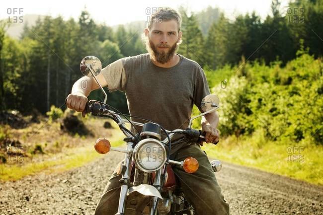 Portrait of young man on motorcycle