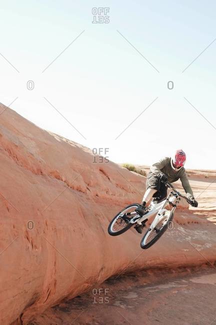 Man doing a stunt on a BMX bicycle