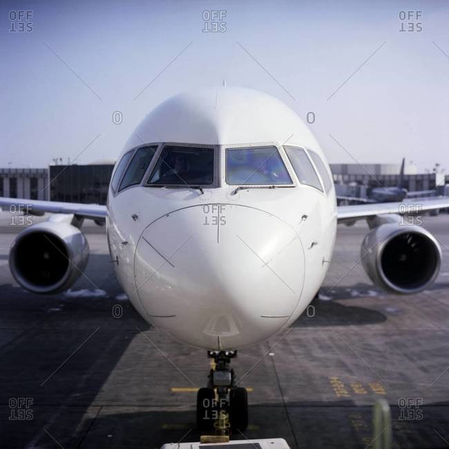 Commercial airline jet parked at gate