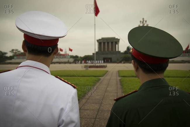 Back view of a Vietnamese soldier and an honor guard at Ho Chi Minh Mausoleum in Hanoi, Vietnam