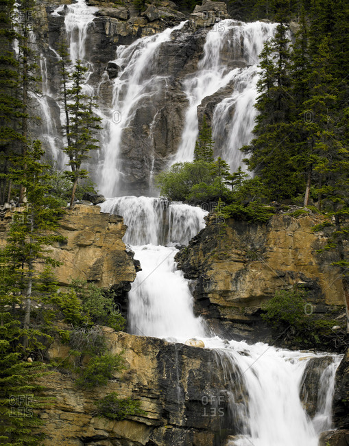 Multiple cascade thunders in Canada's Columbia Icefields Parkway.