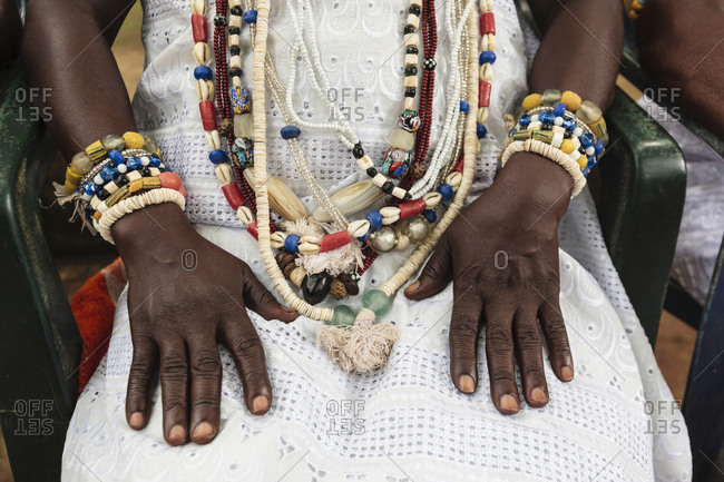 Close-up of priestess\' traditional beaded jewelry in Kpasse Sacred Forest