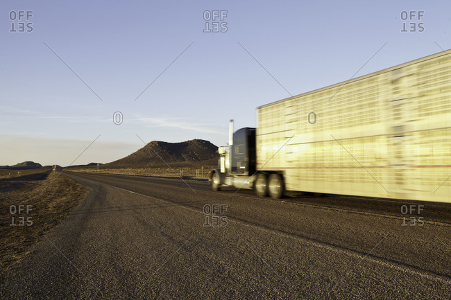 Truck driving on a desert road