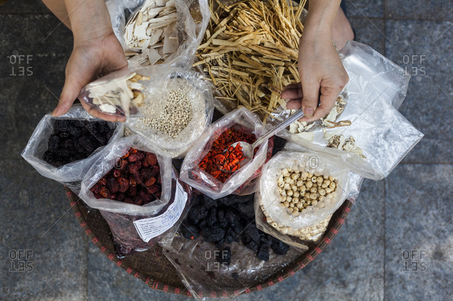 A street side store selling various herbs and roots used in traditional medicine on Lan Ong street in Hanoi\'s Old Quarter, Vietnam.