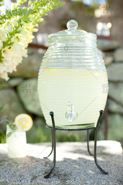 Beverage dispenser with fresh lemonade served in garden