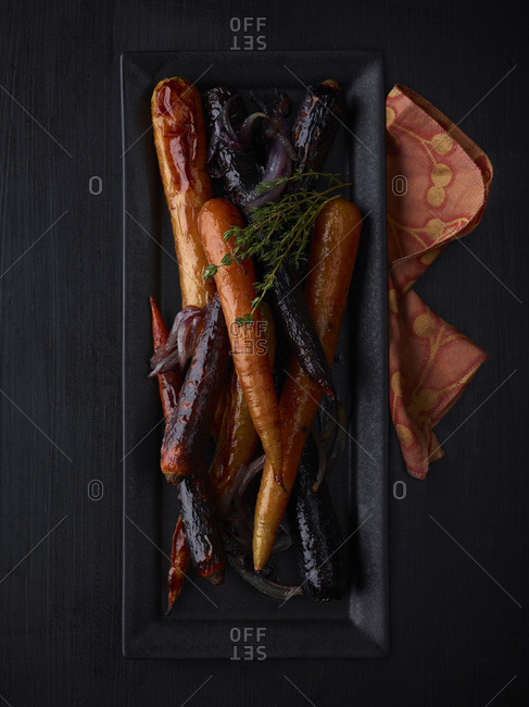 Overhead view of plate of grilled carrots
