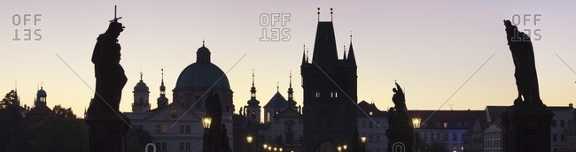 Silhouette of Statues on Charles Bridge, Dome of St. Francis Church and Old Town Bridge Tower, Prague, Bohemia, Czech Republic, Europe