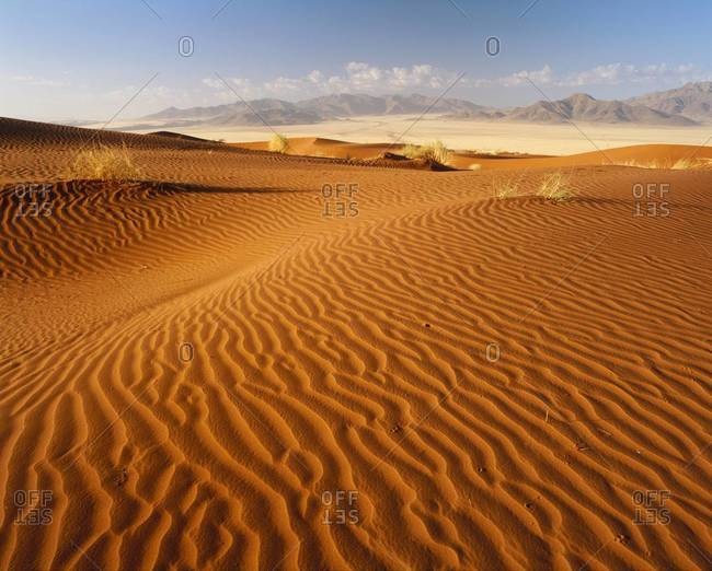 Sand dunes and mountains, Namib Rand game reserve, Namib Naukluft Park, Namibia, Africa