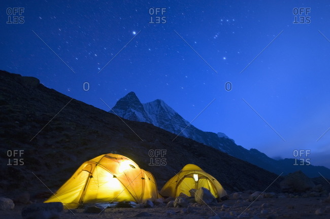 Illuminated tents at Island Peak Base Camp, Solu Khumbu Everest Region, Sagarmatha National Park, Himalayas, Nepal, Asia