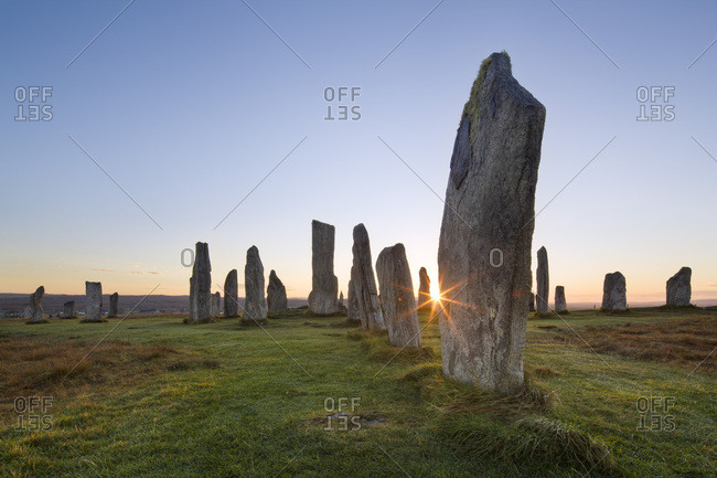 The sun rises at Callanish stone circle, Isle of Lewis, Outer Hebrides, Scotland, United Kingdom