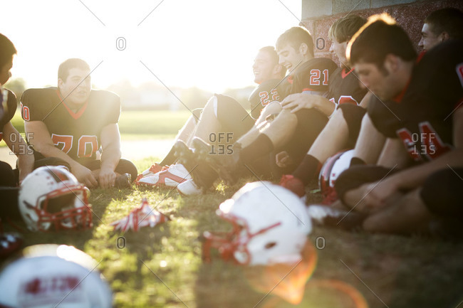 Football players talking after a practice