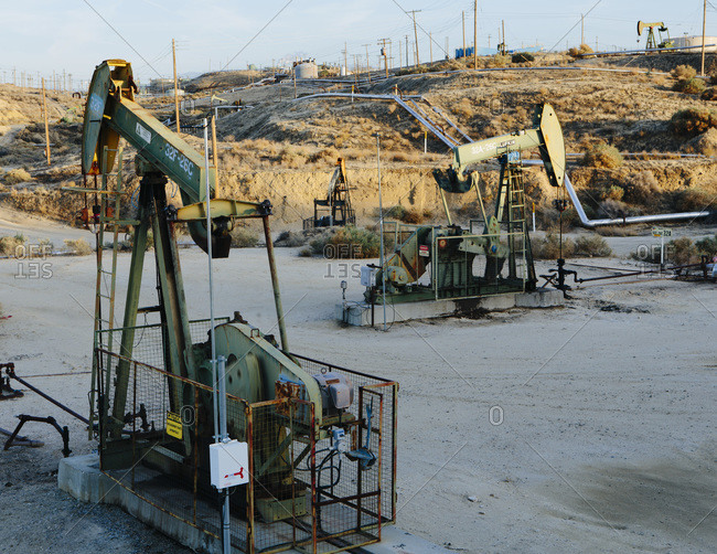 Oil wells drilling in the Midway Sunset petroleum shale fields, near McKittrick, CA