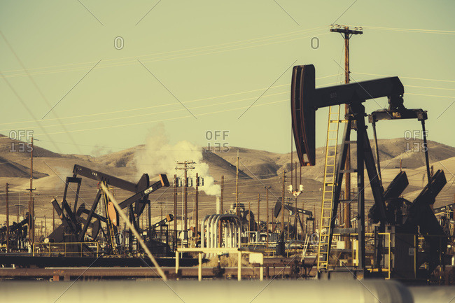 Oil wells drilling in the Midway Sunset petroleum shale fields, near McKittrick, CA