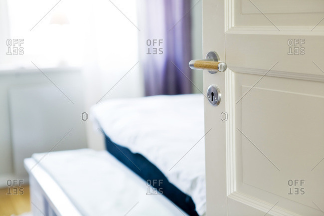 Open white door leading to bedroom