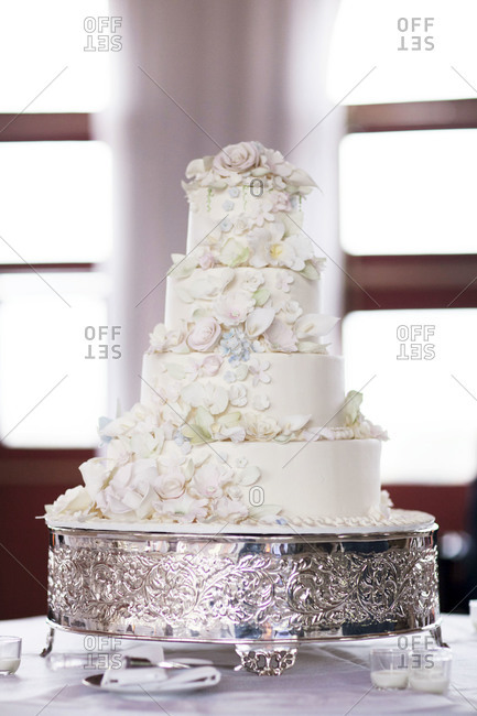 Four-tier wedding cake at wedding reception
