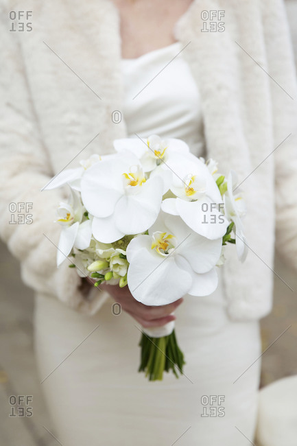 Close up of bride holding bouquet