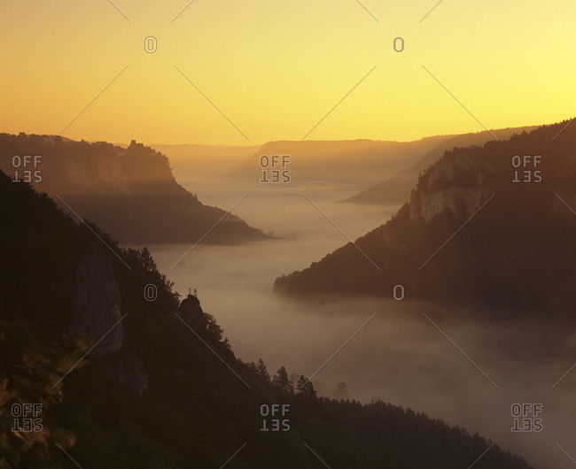 View from Eichfelsen Rock on Schloss Werenwag Castle and Danube Valley at sunrise, Upper Danube Nature Park, Swabian Alb, Baden Wurttemberg, Germany