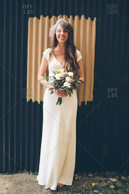 Bride posing with bridal bouquet