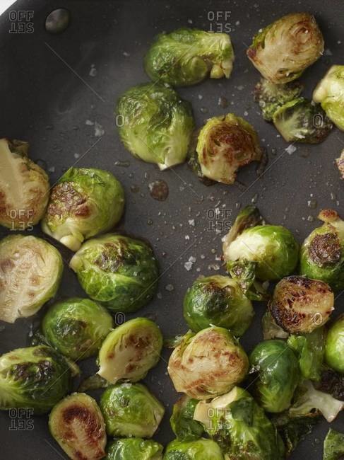 Roasting brussel sprouts in a pan