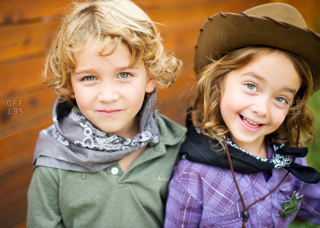 Portrait of fraternal twins in western costume