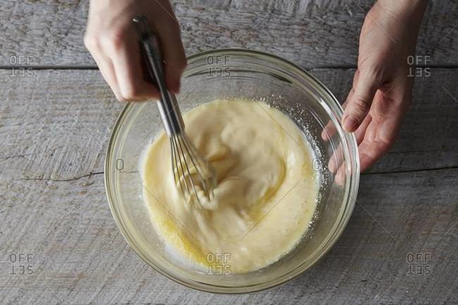 Mixing the liquid ingredients for pancakes with a whisk