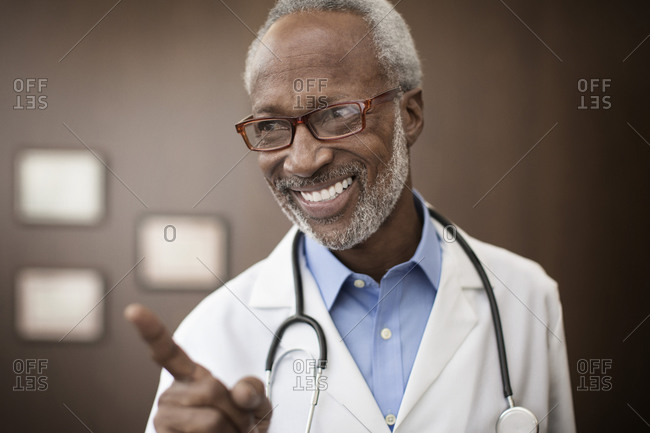 Black doctor smiling in office