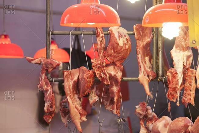 Pork tails hanging in a butcher shop